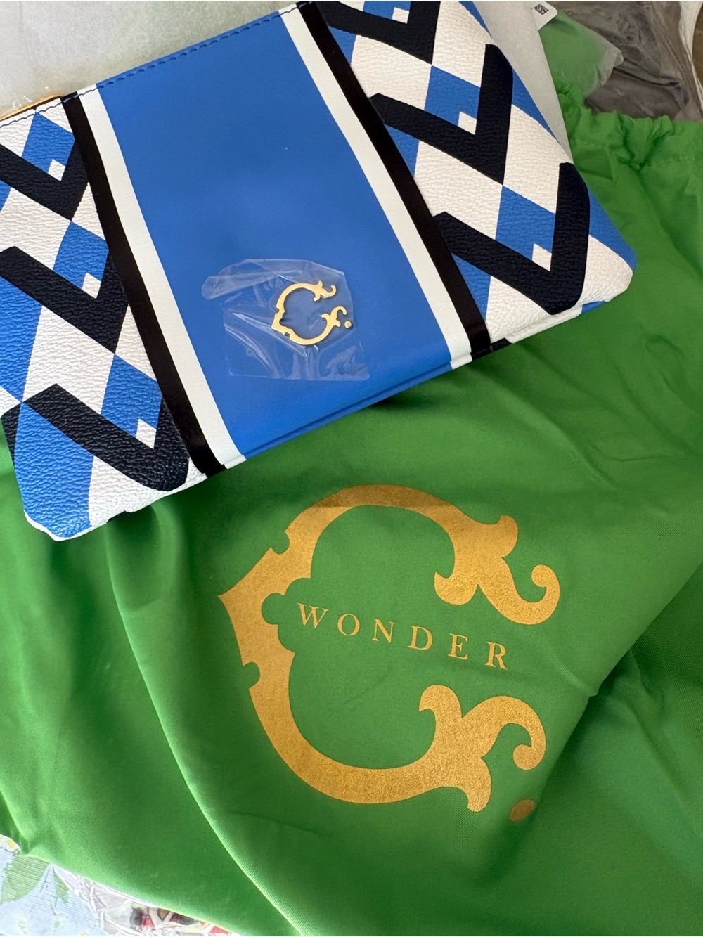 C. Wonder Blue White Black Geometric Clutch